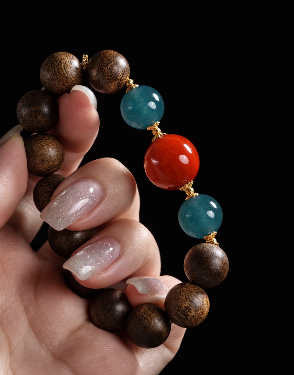 Round beads, turned between two fingers.